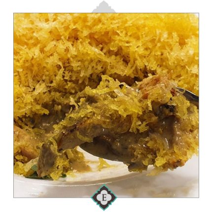 Stripes of chicken fillet simmered in sauce with cream, topped with shredded crispy potatoes