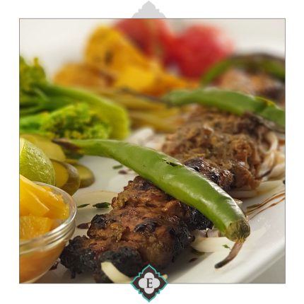 Marinated chicken breast in barberry sauce, homemade herbs and walnuts barbequed to the perfection on skewers served with barbequed tomatoes and sides