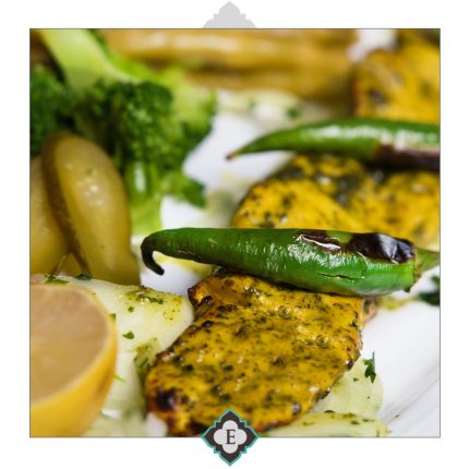 Marinated chicken breast and fillet in homemade herbs and saffron, barbequed to the perfection on skewers served with barbequed tomatoes & sides